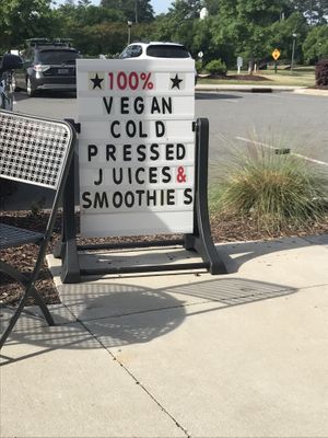 Sign makes it easy to find the storefront  at Pure Juicery Bar in Cary