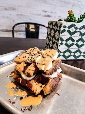 Vegan, gluten free waffle with banana, cacao chips, and peanut butter at Pure Juicery Bar in Cary