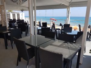 Beach front terrace at Caribe Beach Food & Drink in Finale Ligure