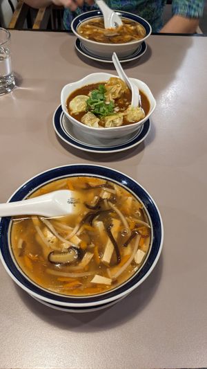 Hot and sour soup (wonton in spicy sauce in back) at Affinity Vegetarian Garden in Winnipeg