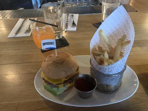 Impossible burger and fries with a Sour Sam cocktail. at Umami Burger - Randolph in Chicago