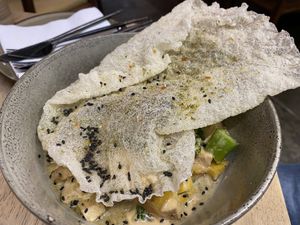 Veg & tofu curry with a rice crisp   at Lexi's Healthy Eatery in Rosebank