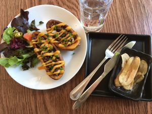 Yellow Submarine & free banana chips! The potato skins could have been a tad crispier, but overall super good. at All You Eat is Love in Chiang Mai