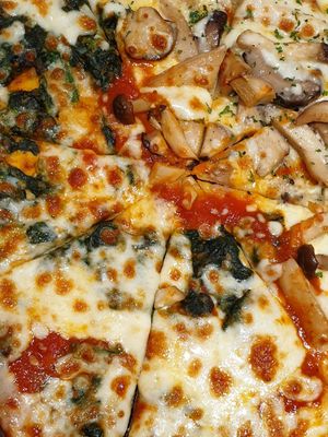 Spanich Olive and Mushroom Pizza at On the Table in Bangkok