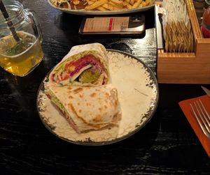 Vegan falafel burrito. It was good! Also very nice location by the sea 🌯 at King's Caffe in Malinska