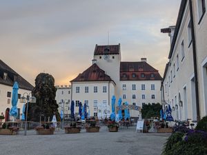 Outdoor eating area at Bräustüberl Schloss in Seefeld