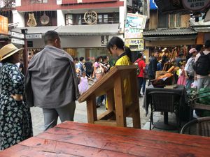 Outdoor seating on the corner of west street at Pure Lotus in Yangshuo