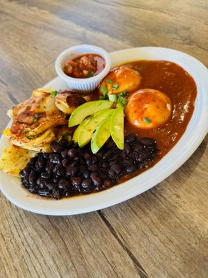 Huevos Rancheros made with Yo vegan poached "eggs". Our black beans, potatoes, rice, salsa verde, and ranchero sauce are all vegan. at Coyote Grill in Laguna Beach