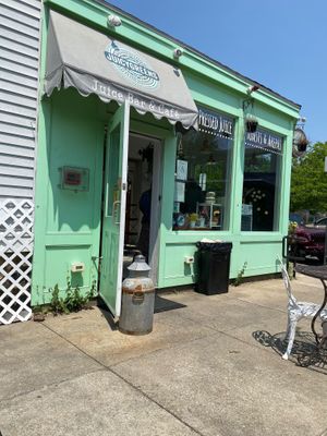 Outdoor seating area and exterior of building  at Juicygreens in Jamaica Plain