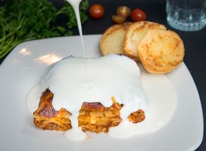 Vegetarian Lasagne with bechamel sauce and garlic bread at Makao in Salento