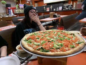large violife pizza with broccoli, spinach, and diced tomatoes.  at Brother's Pizza in Hamilton