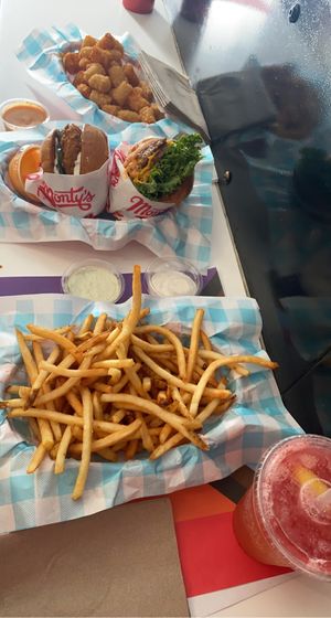 Our spread with a delicious strawberry lemonade to wash it down  at Monty's Good Burger - Koreatown in Los Angeles