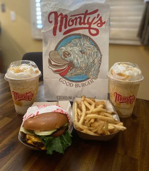 Burger, fries and tater tots, and peach pie milkshakes  at Monty's Good Burger - Koreatown in Los Angeles