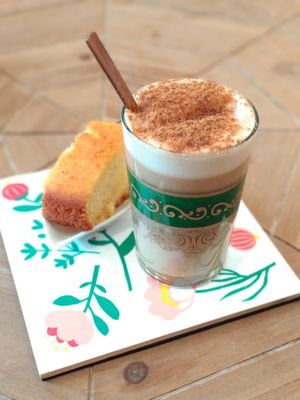 Their "cafe-olé" with a small piece of cake at Okaeri in Gijon