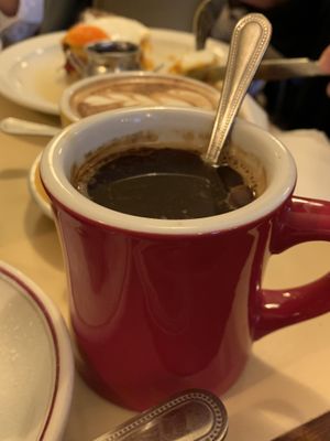 Nice mug filled with an americano coffee  at The Breakfast Club in London