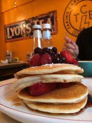 pancake and berries at The Breakfast Club in London