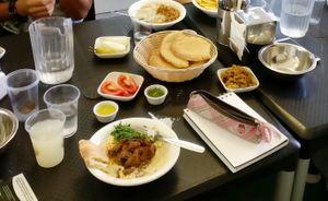 Mushroom Hummus with pitas, pickles & tomatoes at "Hummus Eliahou" at Hummus Eliahou in Afula