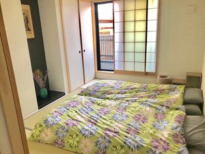 Bedroom (after being used) at Vegan Minshuku Sanbiki Neko in Kyoto