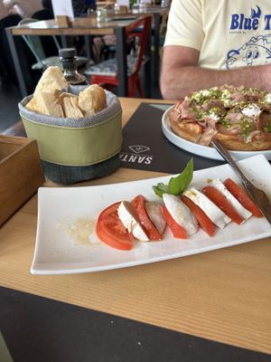 Caprese salad and vegan pizza  at Santa - La Pizza Buona e Giusta in Desenzano Del Garda