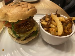 Burger with onion rings   at Fresh Kitchen & Juice Bar in Toronto