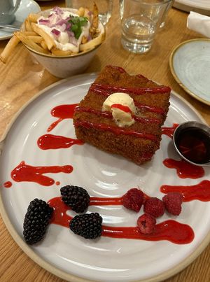 Almond butter French toast with a side of Dutch fries.   at Fresh Kitchen & Juice Bar in Toronto