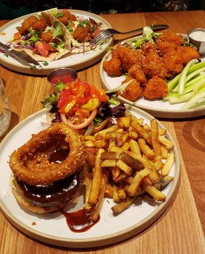 BBQ burger with French fries, buffalo cauliflower with ranch dip, and squash tacos. at Fresh Kitchen & Juice Bar in Toronto