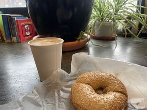 Poppyseed bagel with almond butter and latte with oat milk  at The Cornerstone in Guelph