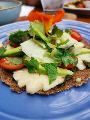 Raw vegan pizza with a pesto base 😋 at Kin Cafe in Seminyak