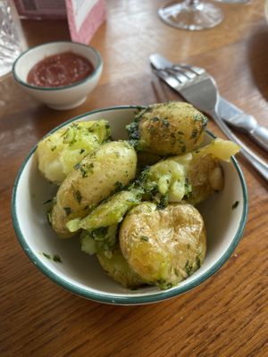 Crushed new potatoes with veg garlic butter   at The Cosy Club in Liverpool