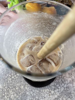 Vietnamese coffee half finished. Why is it lumpy?  at Roots Plant-Based Cafe in Da Nang
