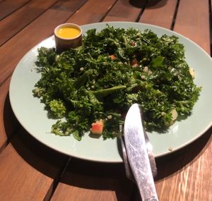 organic kale salad cho tín đồ raw at Roots Plant-Based Cafe in Da Nang