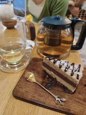 Coconut cake and Japanese tea at Roots Plant-Based Cafe in Da Nang