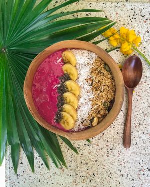 TROPICAL PITAYA BOWL            

Red dragon fruit , Mango , Banana , Crushed ice  , topped with Banana,  Shredded coconut , Chiaseeds and Cinnamon, Cashew , Pumpkin seeds & Raisin Granola.  at Roots Plant-Based Cafe in Da Nang