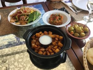 Battata Harra, cubed potato spiced and fried to perfection. at Rahamani Arabian Eatery in Aqaba