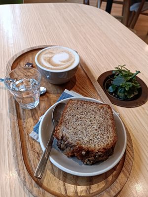 Vegan banana bread and oatmeal cappuccino at Newtree Café in Lyon
