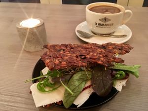 Seed based crisp bread with vegan cheese and decaf coffe with oat milk, yum! at Beck Kaffebar in Stockholm