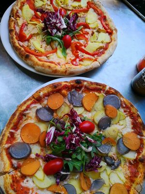 pizza hawaii (with ananas, smoked tofu and bell pepper) & pizza with three different kinds of potatoes  at Plads'n in Copenhagen