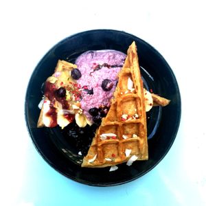 Morning waffle with shiapudding, blueberries, and apple compote. at Cafe Blå in Copenhagen