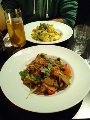 Vegan chicken (this side) and wok of the house (opposite). at Nha Trang Restaurang in Stockholm