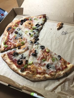 Pizza with vegan cheese, black olives, and green pepper at Mod Pizza - E Broadway in Tucson