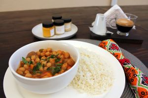 Vegan chickpea curry, coffee with chestnut milk. at Kru Cozinha Saudável in Maputo