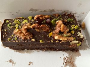 Vegan brownie: contains nuts, which makes it crunchy and gives it a nutty taste. Best brownie I've ever had! at Rabarber in Utrecht