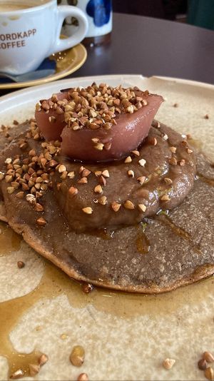 Buckwheat crepes with cardamom date butter and hibiscus stoofpear  at Rabarber in Utrecht
