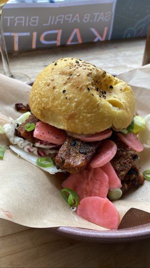 housemade tempeh marinated in miso, with  chicory & radicchio, pickled radish and tamarind mayonnaise, on a grilled sweet potato sourdough bun. Delicious, flavorful  at Rabarber in Utrecht