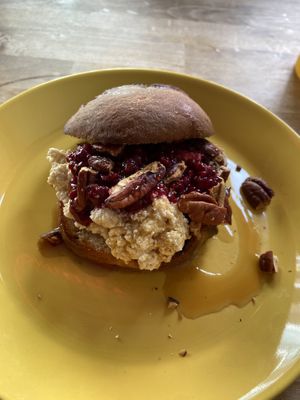 Brioche bun with lemon soy ricotta, raspberry compote and pecan. Nice! at Rabarber in Utrecht