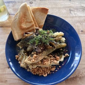 Roasted fennel on white beans hummus with green sauce and pita bread   at Rabarber in Utrecht