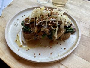 Sourdough bread with miso mushrooms, black cabbage, shallots and ‘zuurzool’. Quite good, but slightly too sour for my taste. at Rabarber in Utrecht