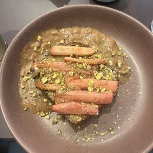 Brioche bun with rhubarb, pistacchio and earl grey sauce. Very nice!   at Rabarber in Utrecht