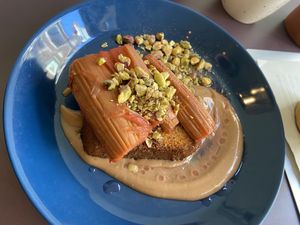 Roasted rhubarb on brioche with terragon/orange creme and pistachio: decent, but more bitter and sour than their previous brioche dishes.  at Rabarber in Utrecht