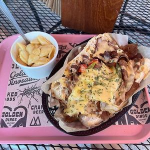 philly cheesesteak and mac !!!! at Golden Dinosaurs in Gulfport